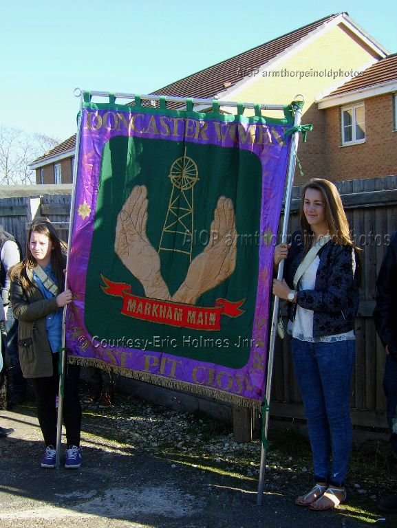 2 Young Ladies take up the Womens Banner.